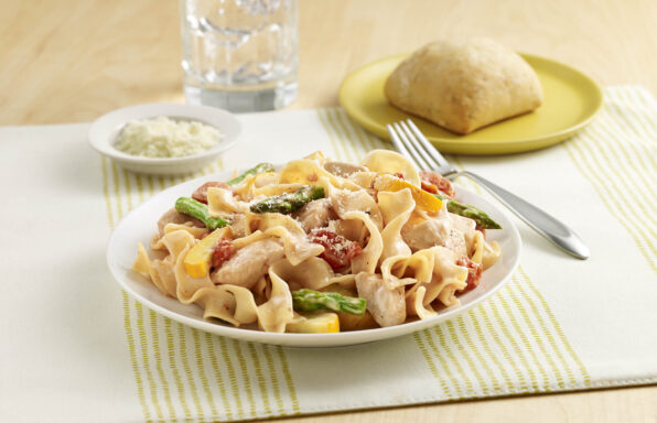 Chicken Noodle Primavera An egg noodle recipe with chicken, fresh vegetables, seasoned tomatoes and Alfredo sauce.