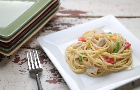 Peppers, chicken, and spaghetti coated in a creamy sauce